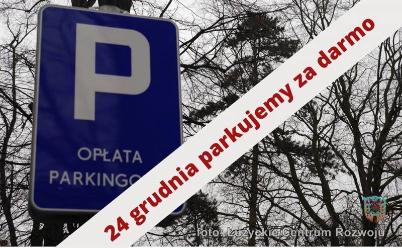 Na zdjęciu znak "Opłata parkingowa" i napis: 24 grudnia parkujemy za darmo